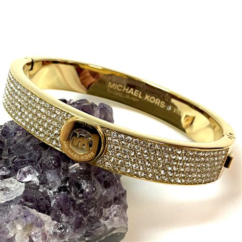 shiny gold tone michael kors hinged bracelet